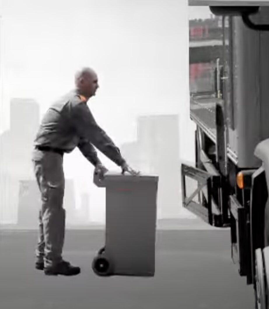 Technician loading a secure container into a truck
